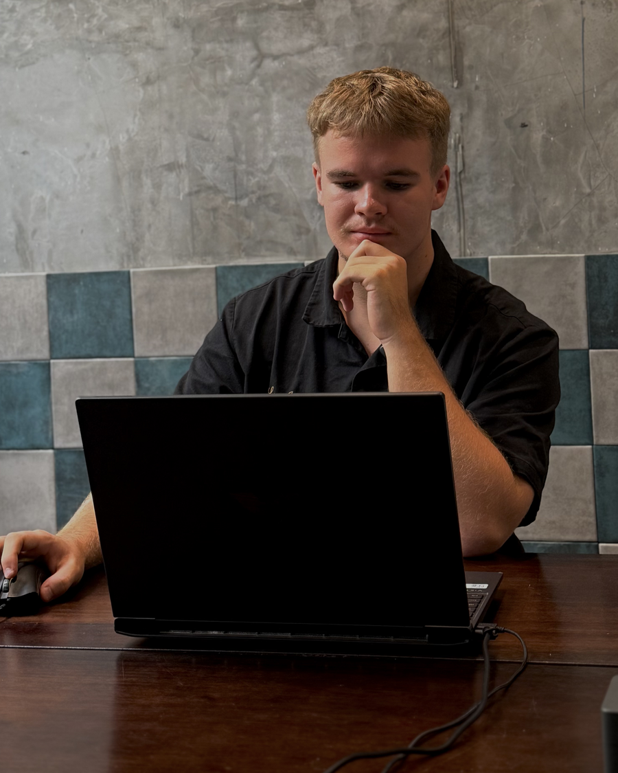 Archie, founder of IlluminateAI, at his desk